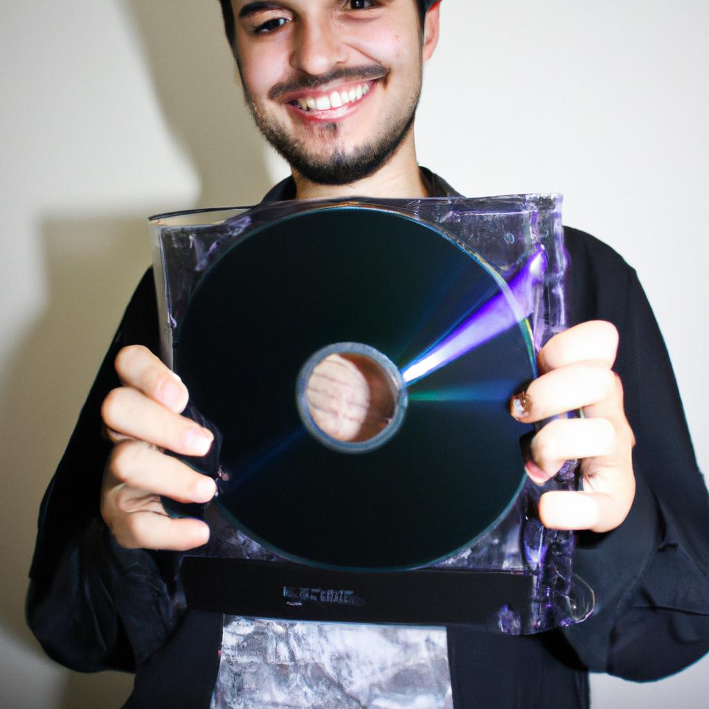 Person holding DVD case, smiling