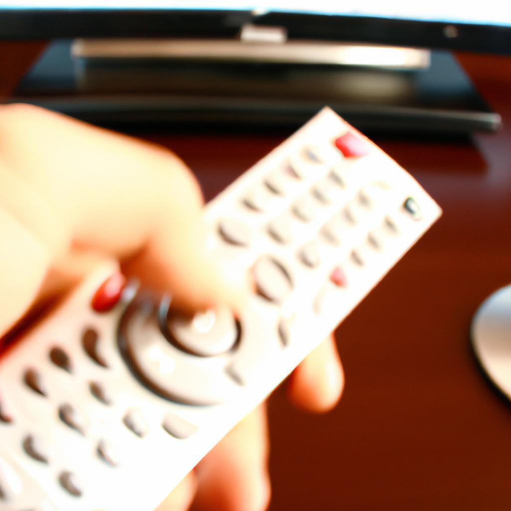 Person using DVD remote control